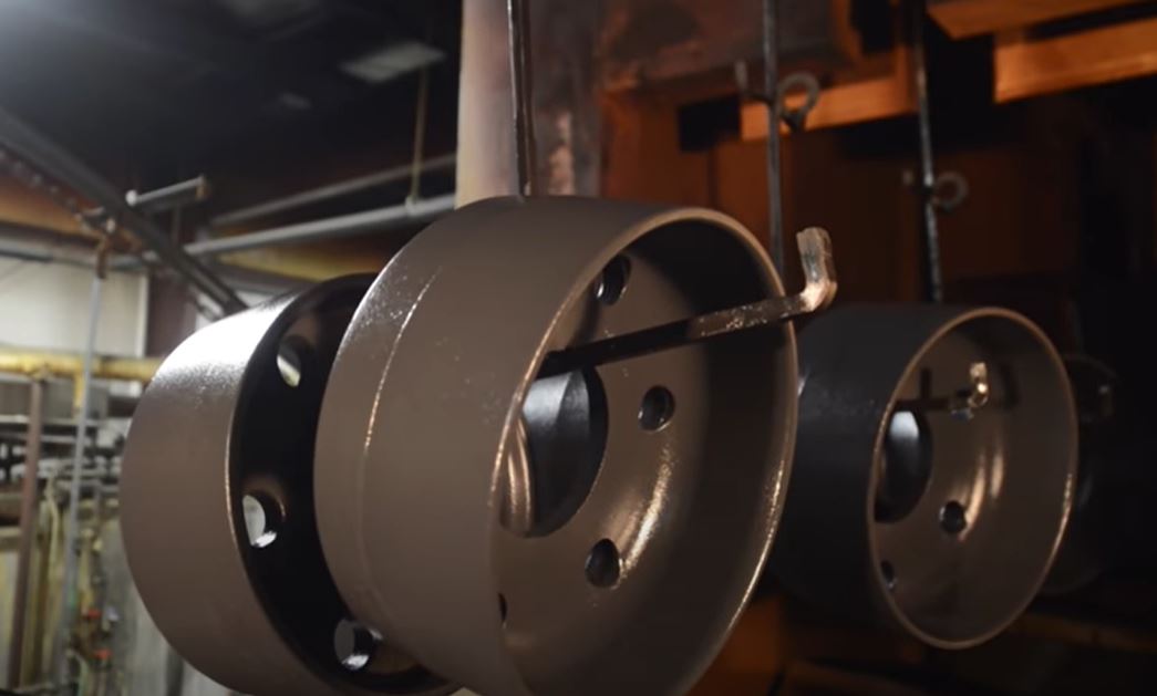 E-Coated Aluminum Parts Entering Curing Chamber